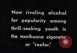Image of marijuana cigarette New York City USA, 1939, second 6 stock footage video 65675035678