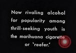 Image of marijuana cigarette New York City USA, 1939, second 7 stock footage video 65675035678