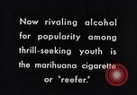 Image of marijuana cigarette New York City USA, 1939, second 11 stock footage video 65675035678
