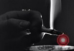 Image of marijuana cigarette New York City USA, 1939, second 57 stock footage video 65675035678