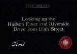 Image of Seam locomotive pulling train up the West side of Manhattan New York City USA, 1915, second 1 stock footage video 65675035688