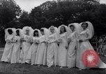 Image of Nine couples marry in Brooklyn's Prospect Park New York City USA, 1967, second 5 stock footage video 65675035699