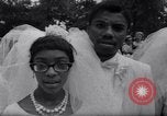 Image of Nine couples marry in Brooklyn's Prospect Park New York City USA, 1967, second 32 stock footage video 65675035699