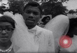 Image of Nine couples marry in Brooklyn's Prospect Park New York City USA, 1967, second 33 stock footage video 65675035699
