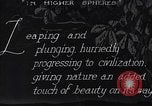 Image of waterfall and wild flowers United States USA, 1920, second 8 stock footage video 65675035759