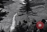 Image of waterfall and wild flowers United States USA, 1920, second 24 stock footage video 65675035759