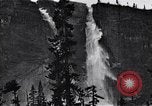 Image of waterfall and wild flowers United States USA, 1920, second 39 stock footage video 65675035759