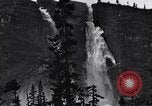 Image of waterfall and wild flowers United States USA, 1920, second 42 stock footage video 65675035759