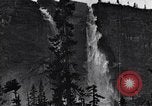 Image of waterfall and wild flowers United States USA, 1920, second 44 stock footage video 65675035759