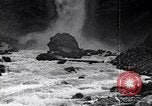 Image of waterfall and wild flowers United States USA, 1920, second 53 stock footage video 65675035759