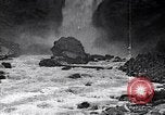 Image of waterfall and wild flowers United States USA, 1920, second 54 stock footage video 65675035759