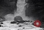 Image of waterfall and wild flowers United States USA, 1920, second 57 stock footage video 65675035759