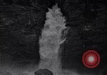 Image of waterfall and wild flowers United States USA, 1920, second 62 stock footage video 65675035759