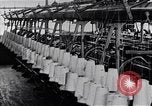 Image of machines and workers manufacturing cloth United States USA, 1920, second 11 stock footage video 65675035761