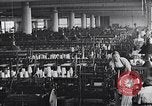 Image of machines and workers manufacturing cloth United States USA, 1920, second 14 stock footage video 65675035761