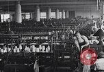 Image of machines and workers manufacturing cloth United States USA, 1920, second 15 stock footage video 65675035761