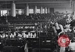 Image of machines and workers manufacturing cloth United States USA, 1920, second 16 stock footage video 65675035761