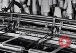 Image of machines and workers manufacturing cloth United States USA, 1920, second 20 stock footage video 65675035761