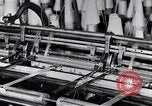 Image of machines and workers manufacturing cloth United States USA, 1920, second 22 stock footage video 65675035761
