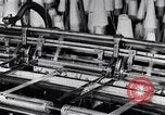 Image of machines and workers manufacturing cloth United States USA, 1920, second 23 stock footage video 65675035761