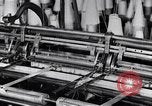 Image of machines and workers manufacturing cloth United States USA, 1920, second 24 stock footage video 65675035761