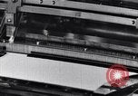 Image of machines and workers manufacturing cloth United States USA, 1920, second 25 stock footage video 65675035761