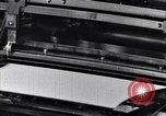 Image of machines and workers manufacturing cloth United States USA, 1920, second 26 stock footage video 65675035761