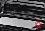 Image of machines and workers manufacturing cloth United States USA, 1920, second 27 stock footage video 65675035761
