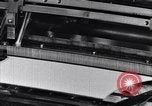 Image of machines and workers manufacturing cloth United States USA, 1920, second 28 stock footage video 65675035761