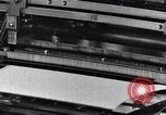 Image of machines and workers manufacturing cloth United States USA, 1920, second 29 stock footage video 65675035761