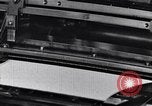 Image of machines and workers manufacturing cloth United States USA, 1920, second 30 stock footage video 65675035761