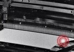 Image of machines and workers manufacturing cloth United States USA, 1920, second 31 stock footage video 65675035761