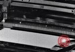 Image of machines and workers manufacturing cloth United States USA, 1920, second 32 stock footage video 65675035761
