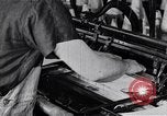 Image of machines and workers manufacturing cloth United States USA, 1920, second 33 stock footage video 65675035761