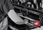 Image of machines and workers manufacturing cloth United States USA, 1920, second 34 stock footage video 65675035761