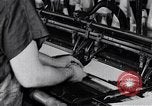 Image of machines and workers manufacturing cloth United States USA, 1920, second 35 stock footage video 65675035761
