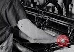 Image of machines and workers manufacturing cloth United States USA, 1920, second 36 stock footage video 65675035761