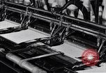 Image of machines and workers manufacturing cloth United States USA, 1920, second 37 stock footage video 65675035761
