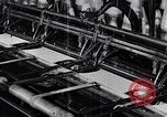 Image of machines and workers manufacturing cloth United States USA, 1920, second 38 stock footage video 65675035761