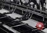 Image of machines and workers manufacturing cloth United States USA, 1920, second 39 stock footage video 65675035761