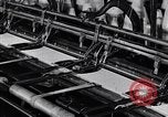 Image of machines and workers manufacturing cloth United States USA, 1920, second 40 stock footage video 65675035761