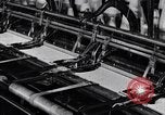 Image of machines and workers manufacturing cloth United States USA, 1920, second 41 stock footage video 65675035761