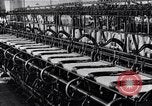 Image of machines and workers manufacturing cloth United States USA, 1920, second 42 stock footage video 65675035761