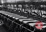 Image of machines and workers manufacturing cloth United States USA, 1920, second 43 stock footage video 65675035761