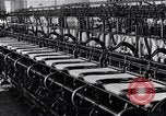 Image of machines and workers manufacturing cloth United States USA, 1920, second 44 stock footage video 65675035761