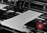 Image of machines and workers manufacturing cloth United States USA, 1920, second 46 stock footage video 65675035761