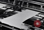Image of machines and workers manufacturing cloth United States USA, 1920, second 50 stock footage video 65675035761
