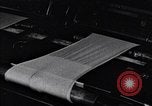 Image of machines and workers manufacturing cloth United States USA, 1920, second 51 stock footage video 65675035761