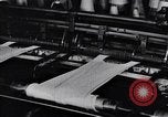 Image of machines and workers manufacturing cloth United States USA, 1920, second 60 stock footage video 65675035761