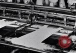 Image of machines and workers manufacturing cloth United States USA, 1920, second 61 stock footage video 65675035761